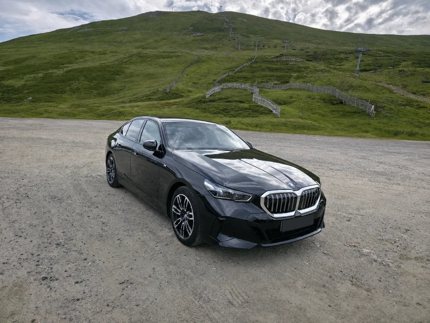 Black BMW i5 eDrive40 M Sport at Glenshee