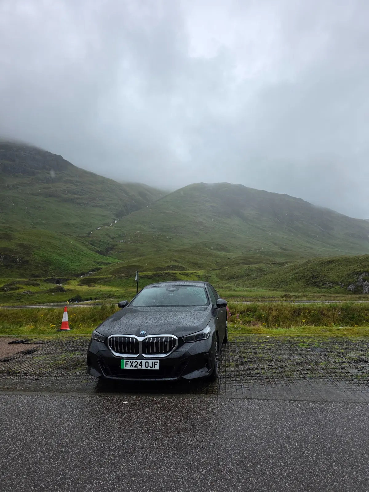 Pazaar Executive BMW i5 in the misty Glen Coe landscape